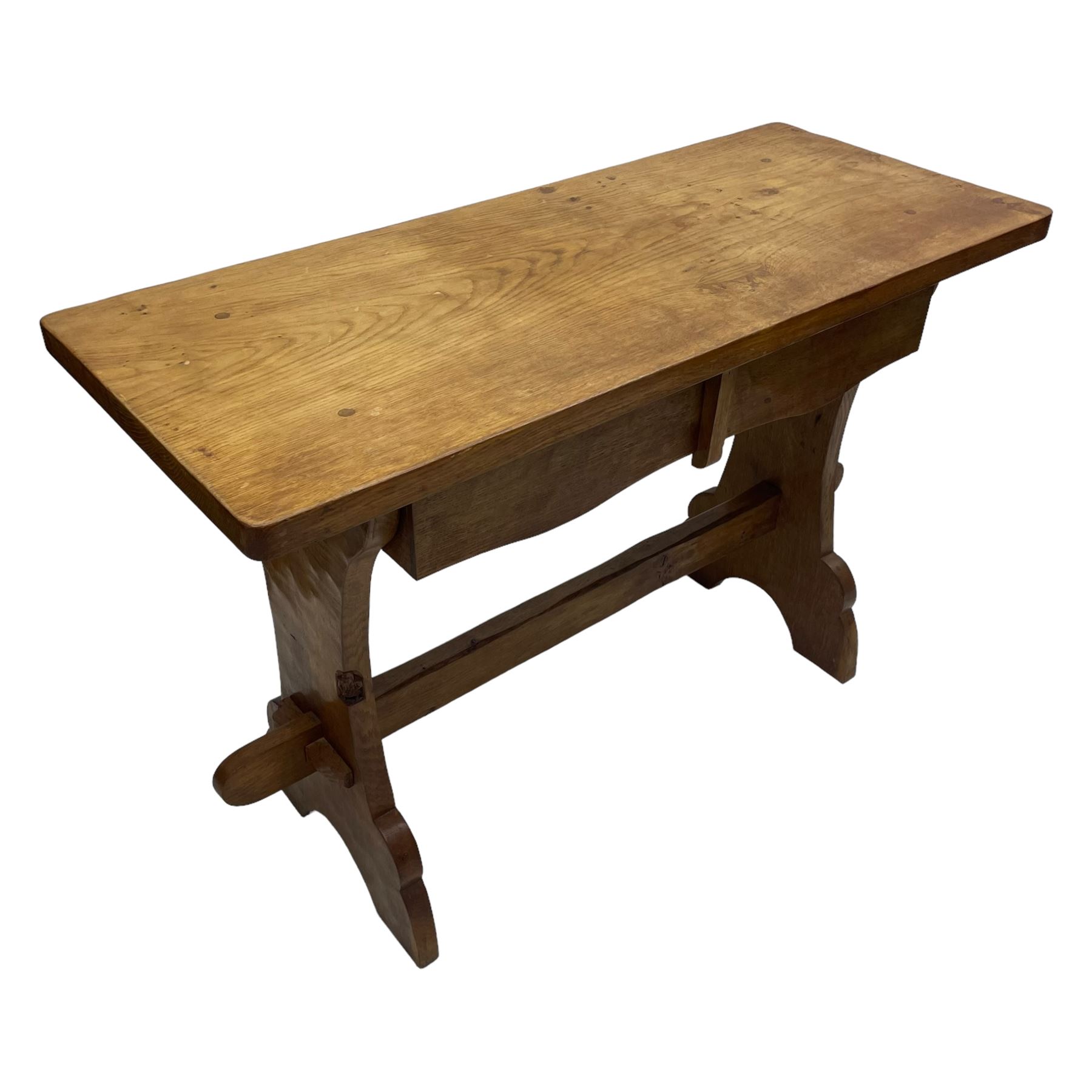 Gnomeman - oak side table, rectangular adzed top over two drawers, on shaped end end supports united by pegged stretcher, carved with gnome signature, by Thomas Whittaker, Littlebeck 