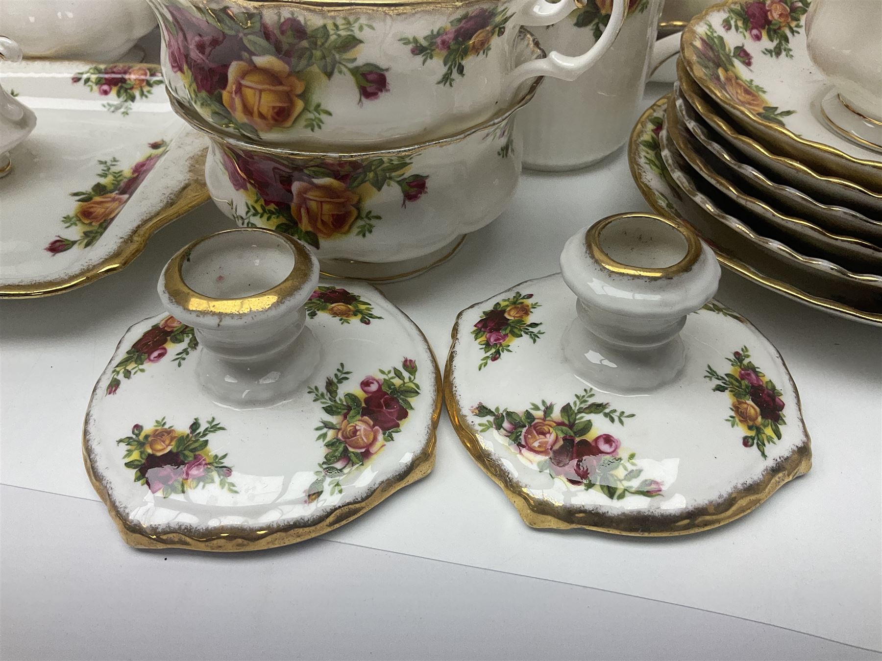 Royal Albert Old Country Roses pattern part tea and dinner service, to include two tureens, eight dinner plates, six side plates, twelve bowls, two mugs, seven teacups and saucers, milk jug,  twelve cake plates, six soup bowls and saucers, candlesticks, etc (95)