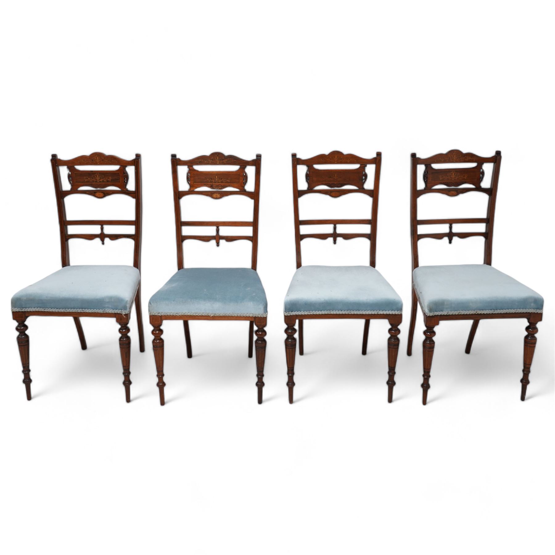 Edwardian inlaid mahogany and rosewood salon suite - two-seat sofa (W112cm, H90cm, D60cm); set of four side chairs (W44cm, H90cm); inlaid with scrolling foliate motifs, upholstered in light blue fabric, on turned supports inlaid with boxwood stringing