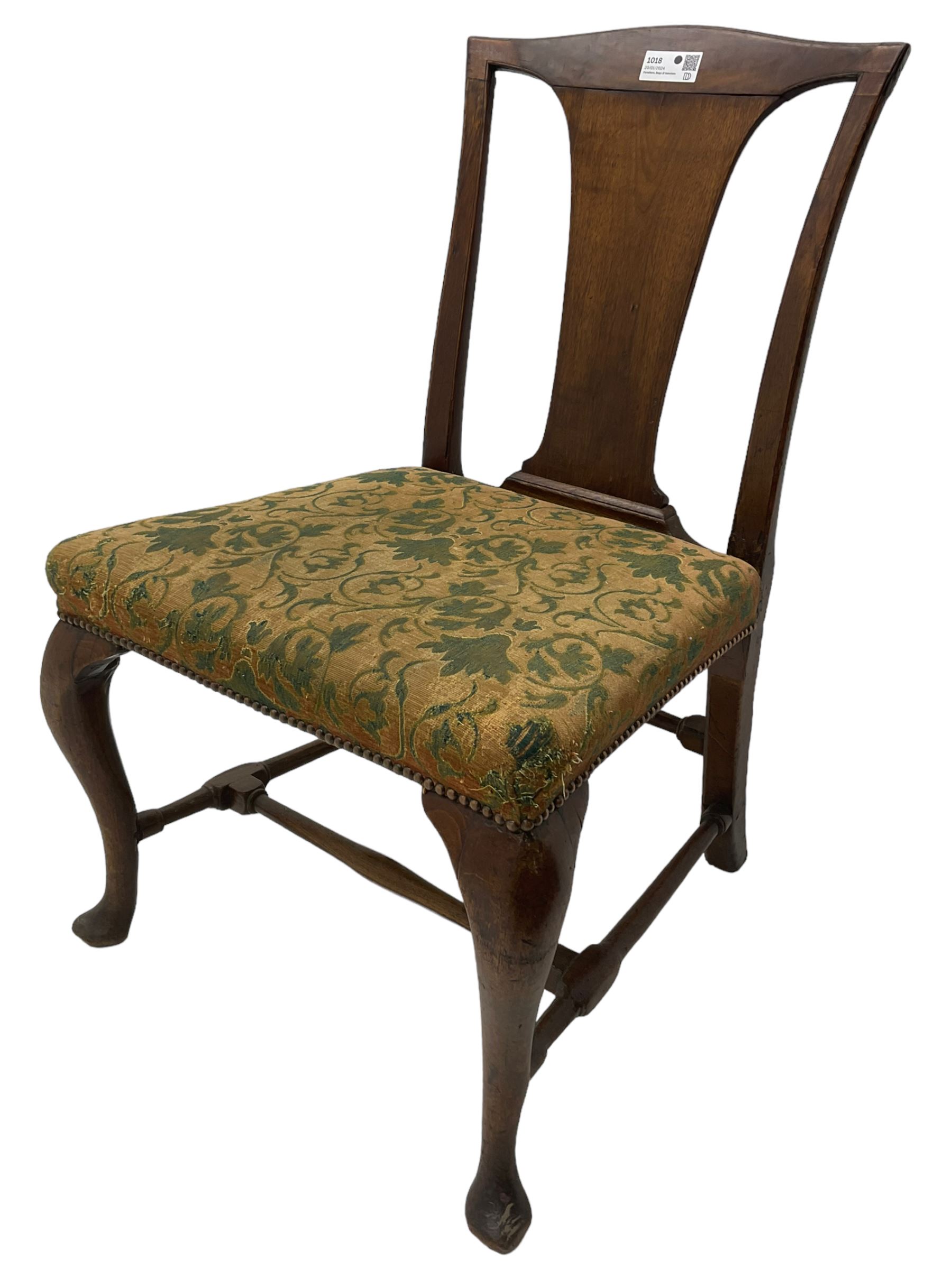 Mid-18th century mahogany side chair, shaped cresting rail over tapered back splat, seat upholstered in green and camel foliate patterned fabric with stud work border, raised on cabriole supports united by swell-turned stretchers