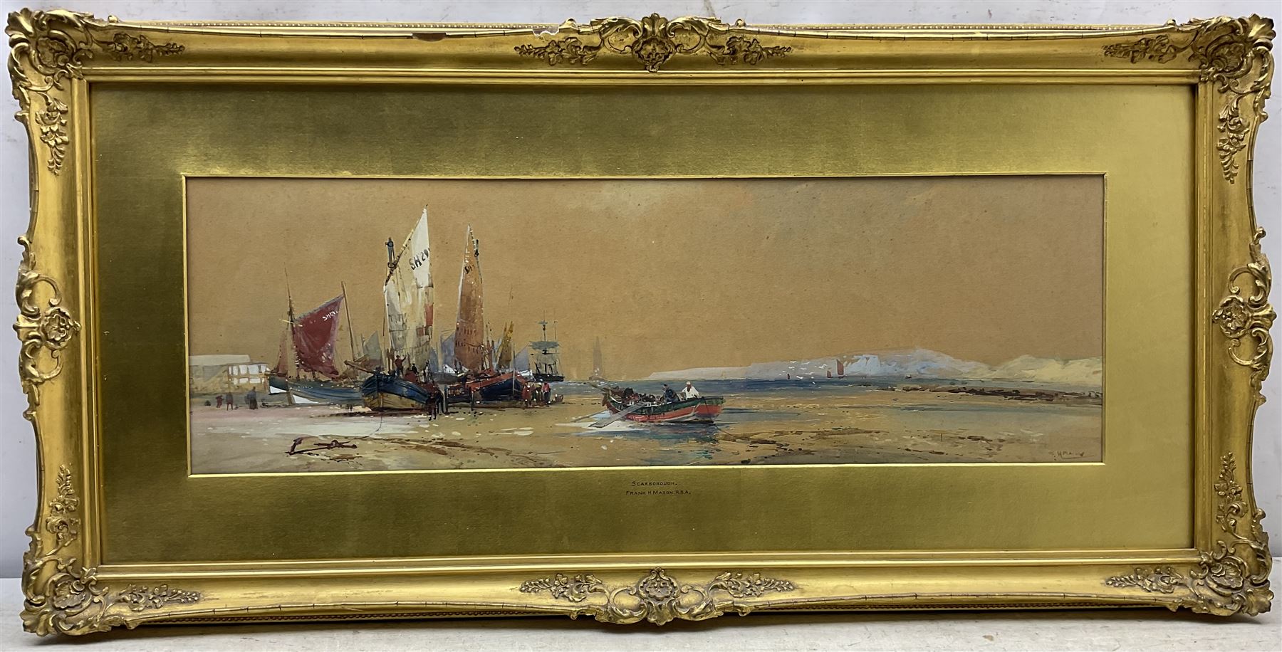 Frank Henry Mason (Staithes Group 1875-1965): Unloading Boats at 'Scarborough', watercolour signed, titled on the mount, original John Linn & Sons label verso 24cm x 75cm