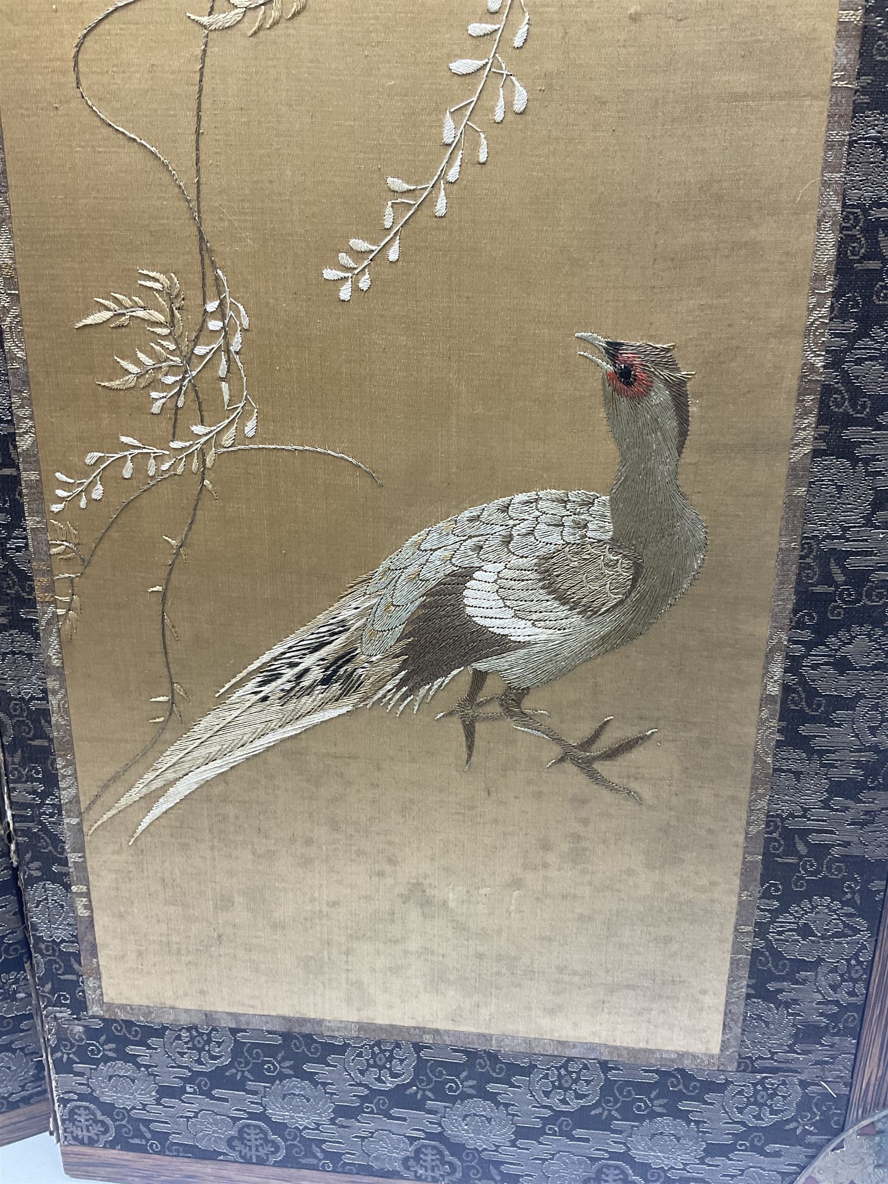 Two Oriental silk and wooden screens embroidered with birds and blossoming branches, largest H88cm 