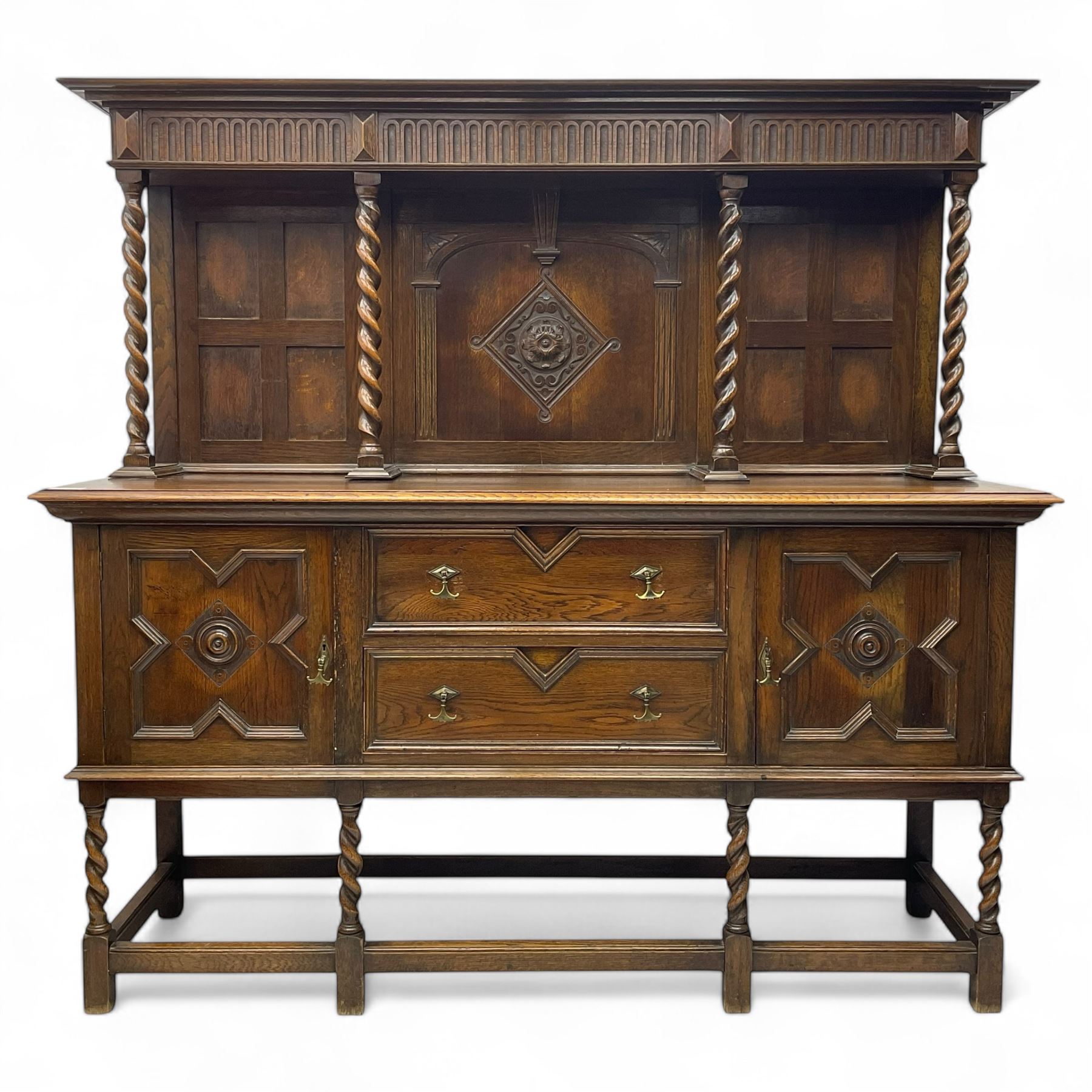 Jacobean Revival oak dresser, projecting moulded cornice over arcade carved frieze and panelled back, on spiral turned supports, moulded rectangular top over two cupboards and two drawers, on spiral turned supports united by moulded stretchers 