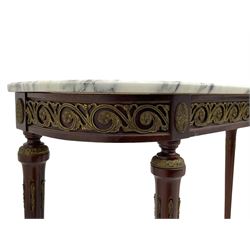 Pair of late 20th century French design mahogany console tables, D-end form with white and grey veined marble tops, the frieze rails decorated with scrolled leaf and flower head cast brass mounts, on turned and fluted supports with cast brass mounts and feet 