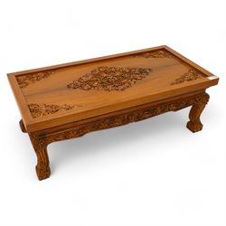 Hardwood rectangular coffee table, carved with trailing branches with foliage and flower h...