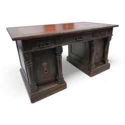 Late Victorian oak twin pedestal desk, rectangular moulded top with brown leather inset, t...