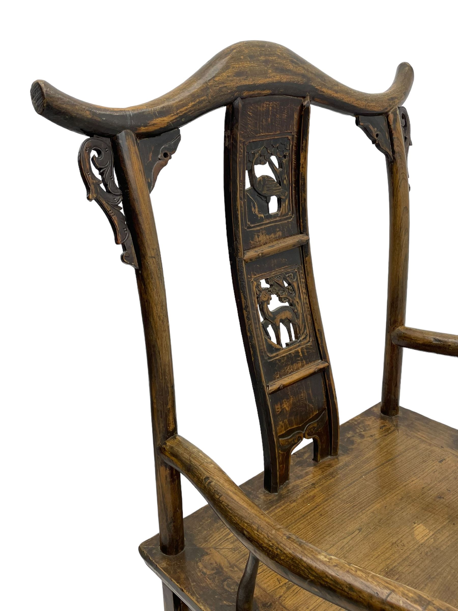 Chinese design elm yoke back 'official's' armchair, the shaped cresting rail over splat decorated with carved and pierced wildlife scenes, shaped projecting arms over rectangular seat, square supports united by plain stretchers, decorated with shaped frame brackets carved with foliage