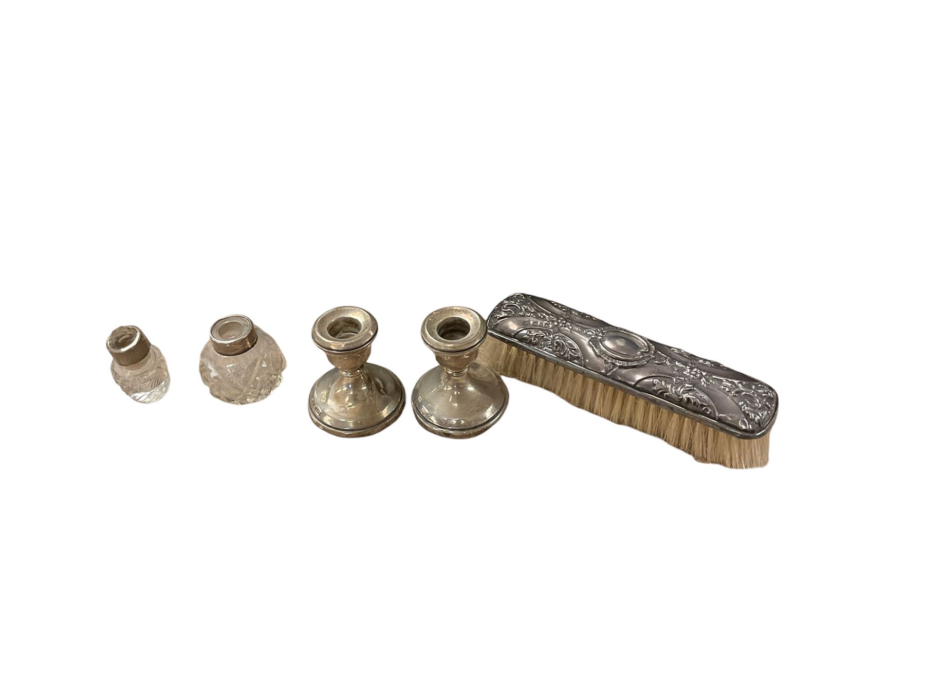 Silver candlesticks, hallmarked, together with silver brush and scent bottles with silver collars and other items  