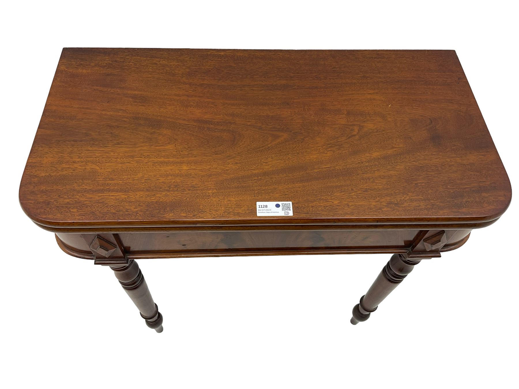 19th century mahogany tea table, fold-over swivel action rectangular top with rounded corners, figured frieze with stepped lozenge mounts, on turned supports