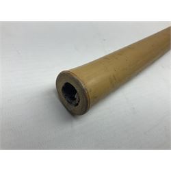 Bamboo cane torch, the pierced brass cover opening to reveal a wick, H144cm