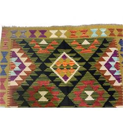 Chobi kilim multi-coloured rug, the field decorated with various lozenges with dark indigo borders, enclosed by a guard band with repeating broken-lozenge design