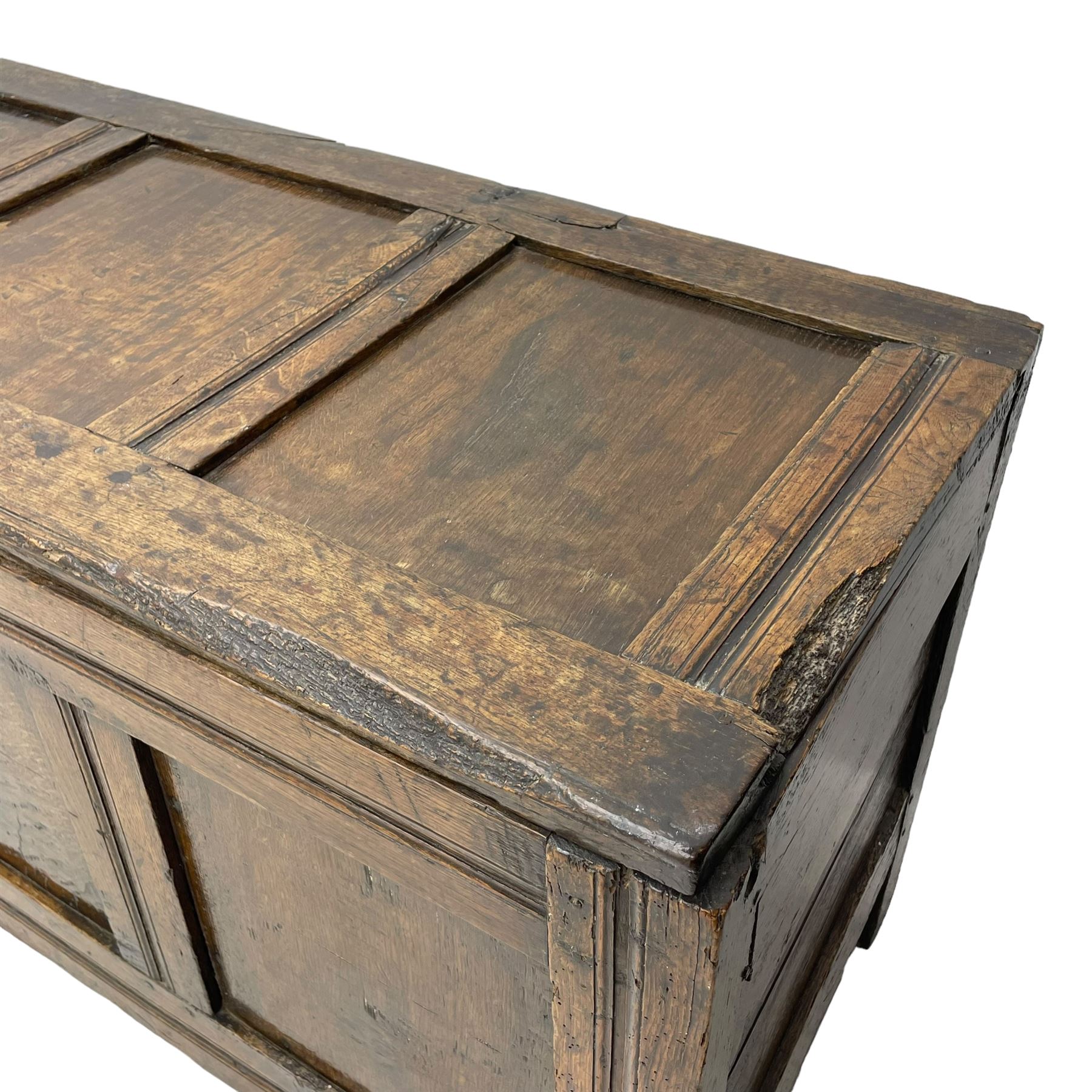 17th century panelled oak blanket chest or kist, quadruple panelled hinged lid over quadruple panelled front, moulded frame and pegged construction, on stile supports