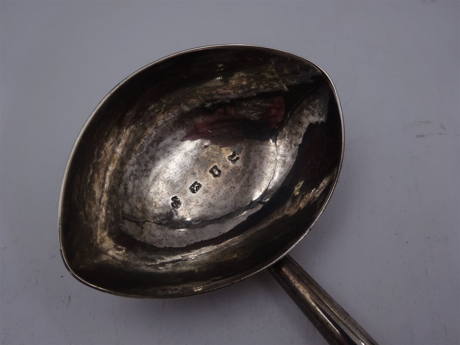 George II silver toddy ladle, the silver bowl of oval form, with engraved initials to underside, hallmarked London 1741, maker's mark indistinct, with turned wooden handle, L33cm