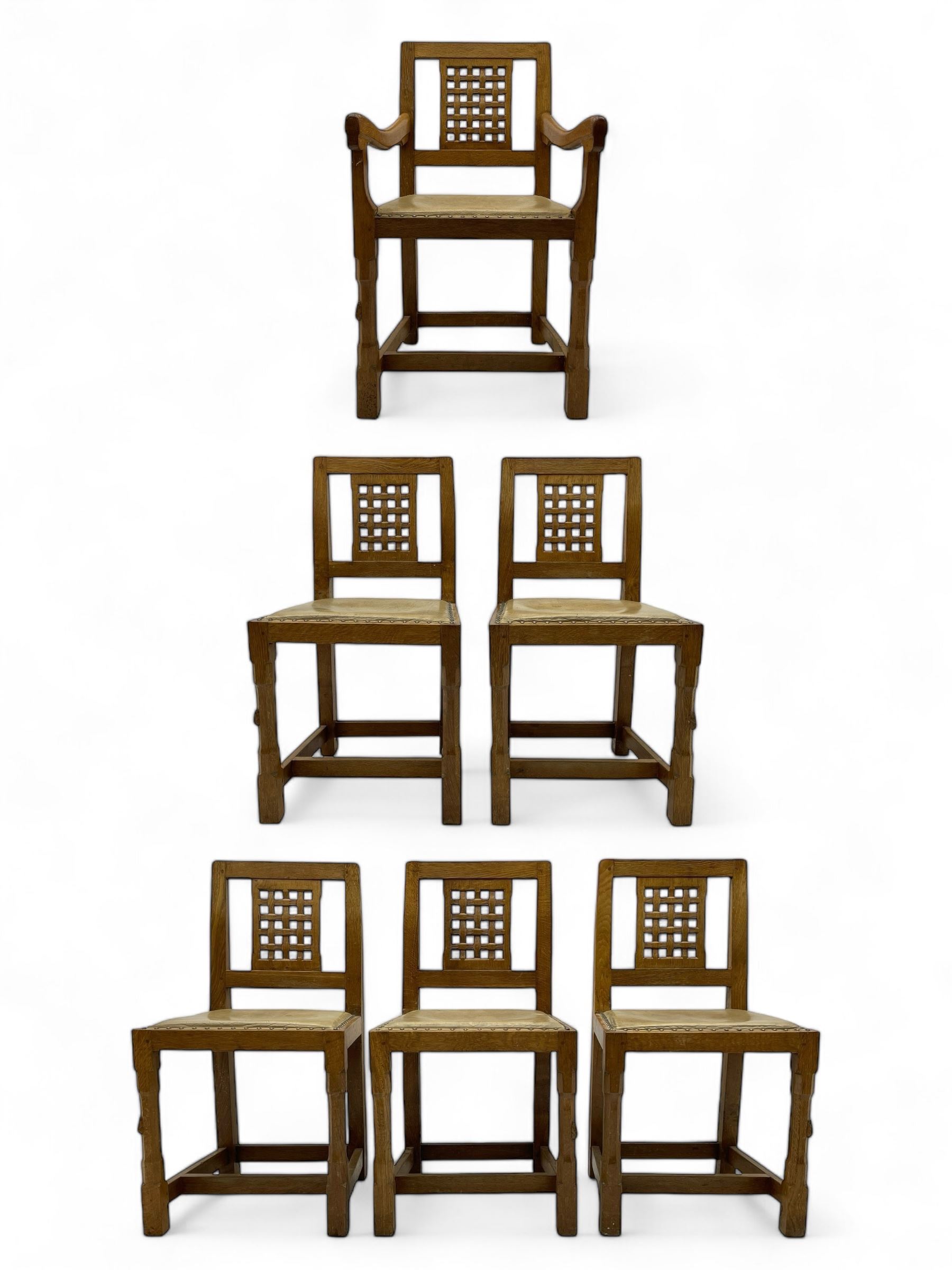 Rabbitman - set of six (5+1) oak dining chairs, pierced and carved lattice back, leather upholstered seat with stud band, on octagonal supports united by stretchers, carved with rabbit signature, by Peter Heap of Wetwang 