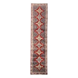 Northwest Persian Senneh crimson ground runner, central medallion design with geometric mo...