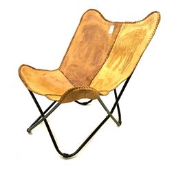Elephant embossed sling chair upholstered in brown leather