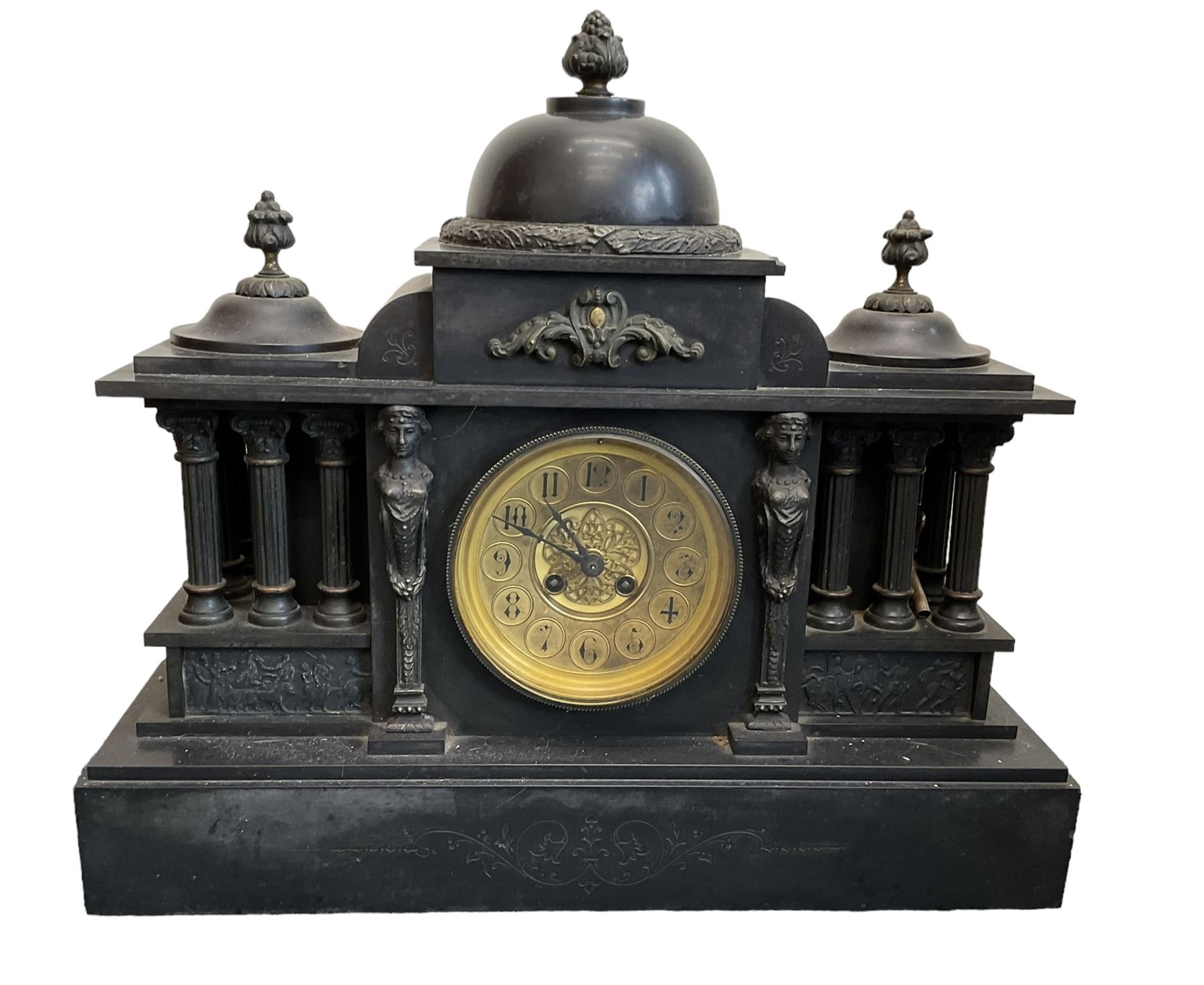 French - late 19th century Belgium slate 8-day mantle clock with conforming side temples, break front case with a central dome, recessed pilasters and a deep stepped plinth, glazed bezel with a brass dial, Arabic numerals and decorated centre, gong striking twin train movement with pendulum and key.