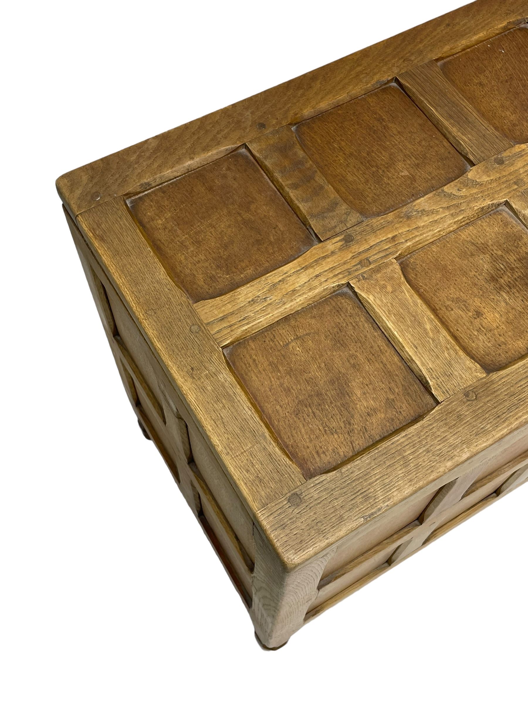 Sid Pollard (ex. Mouseman) - Yorkshire oak blanket chest, all over panelling, enclosed by hinged lid, on octagonal feet, interior plaque inscribed 'S. Pollard, Bagby, Thirsk, Yorks' 