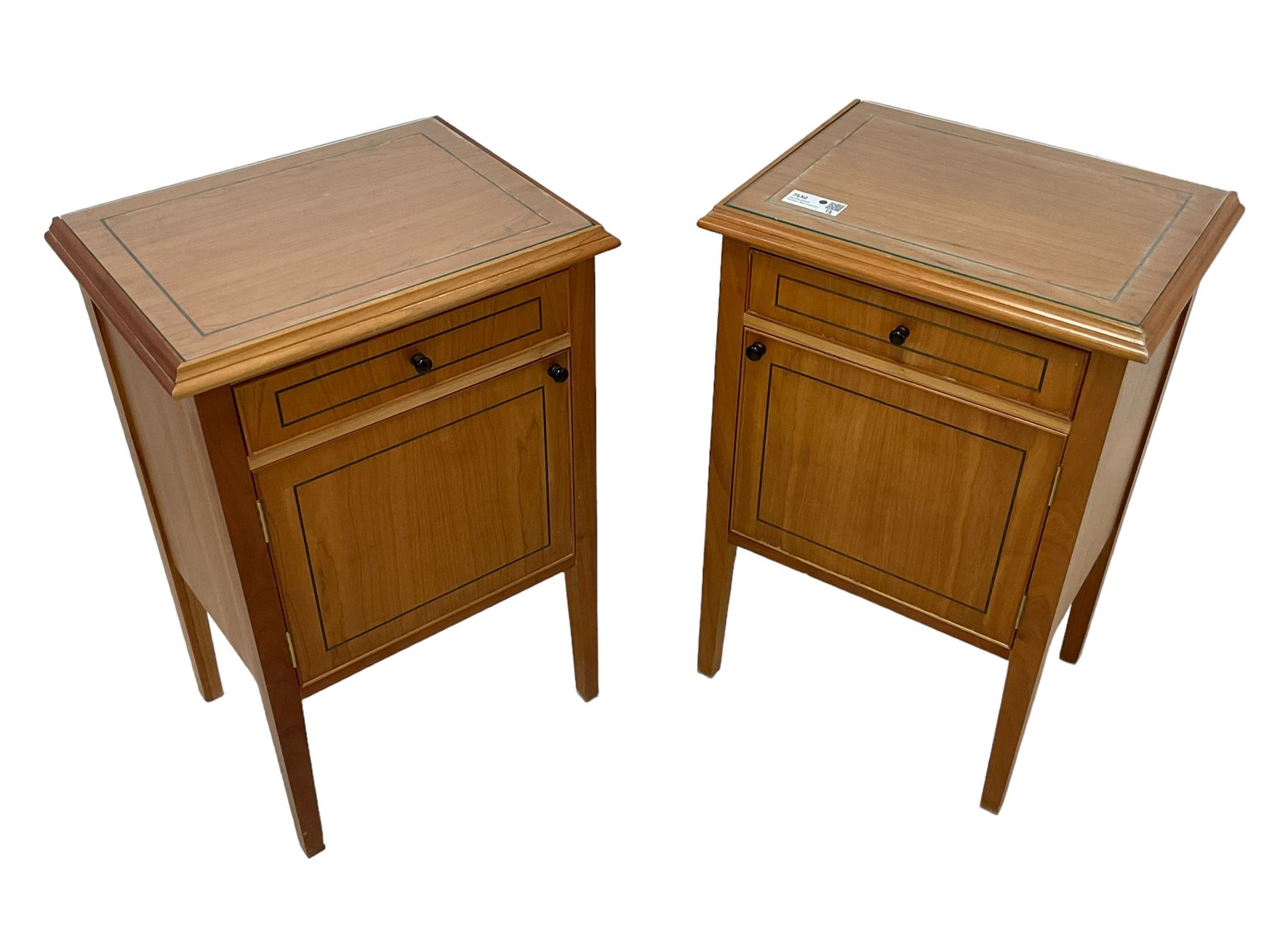 Pair of contemporary cherry wood bedside cupboards, inset glass top in moulded frame, fitted with single drawer over cupboard, on square tapering supports 