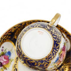 Four early 19th century Spode cups and saucers, two decorated in the Imari palette, pattern no. 2375, and two others, pattern no. 3260 & 1709, together with two early 19th century porcelain rococo revival chambersticks and another Spode tea cup (11)