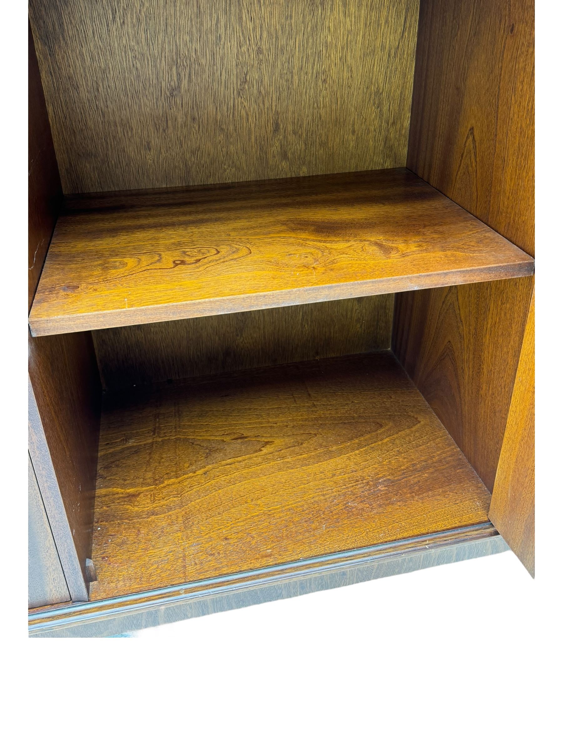 Georgian design mahogany bookcase on cupboard, projecting moulded and dentil cornice, two display cabinets enclosed by glazed doors above over three drawers and three cupboards, on bracket feet