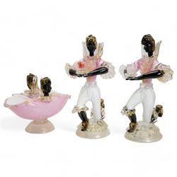 Pair of Murano figural glass Blackamoor candlesticks, each kneeling supporting the single sconce, on domed circular bases with aventurine inclusions, H31cm, together with a matching bowl, L22.5cm (3)