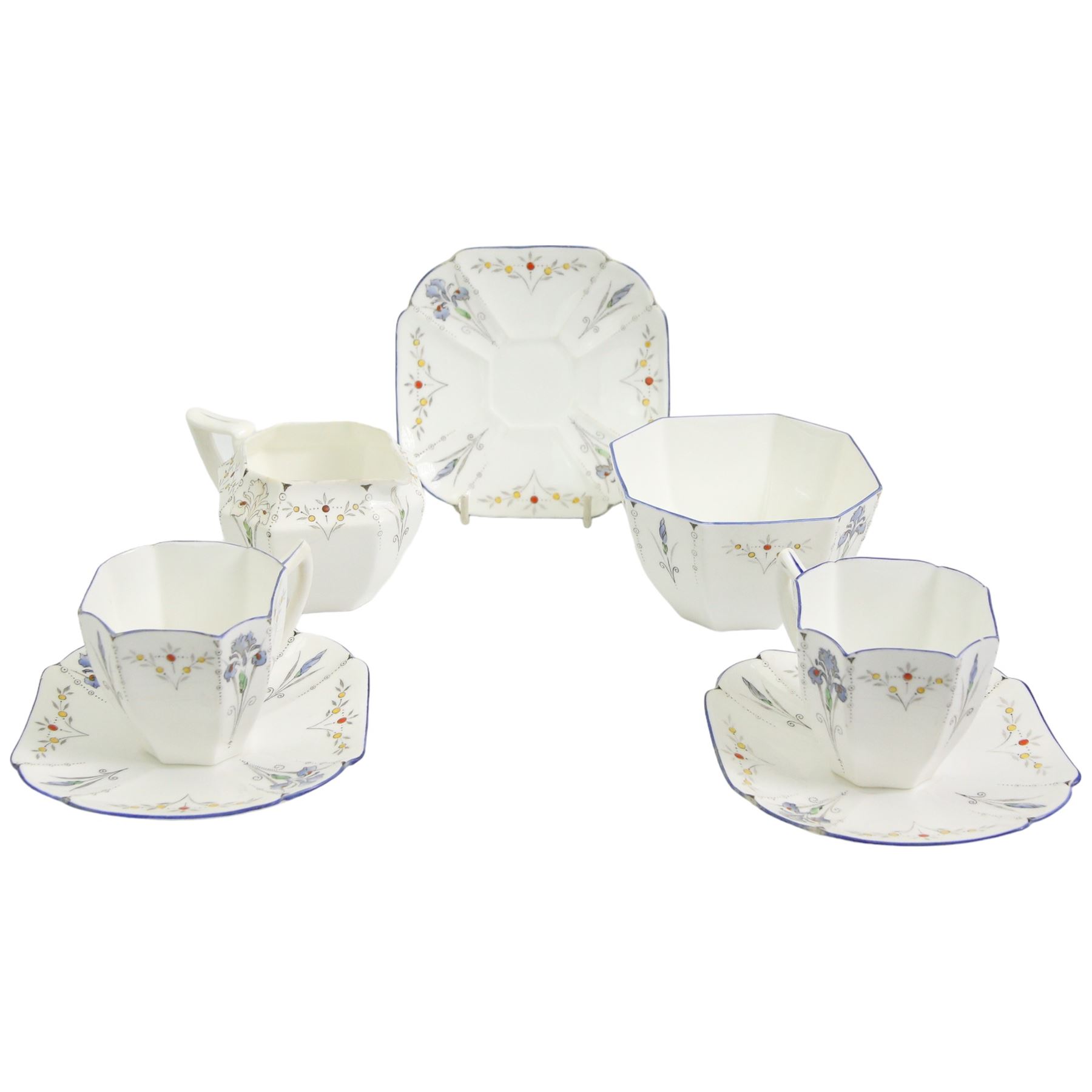 Art Deco Shelley Queen Anne shape part coffee ware decorated in the Blue Iris pattern, comprising two cups, three saucers, sugar bowl and a matching Shelley cream jug