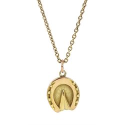 Early 20th century 18ct gold horseshoe pendant, the reverse with monogrammed agate and blo...