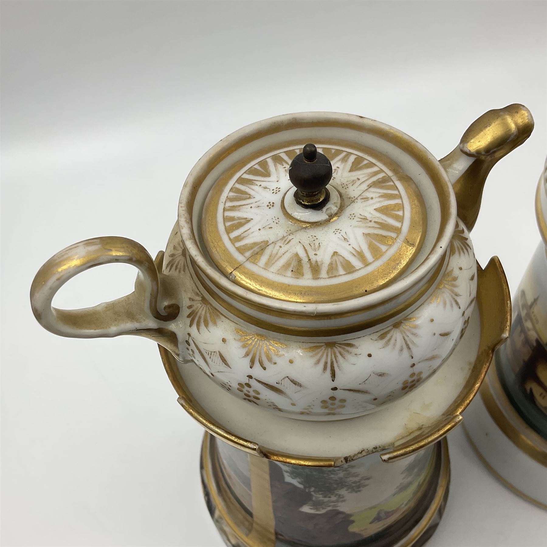 Two 19th century continental teapots and warmers, each teapot upon a cylindrical warming base, hand printed with seascapes, largest H22cm 