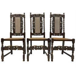 Set of seven (5+2) 19th century Carolean design oak dining chairs, scroll leaf and flower head carved cresting rail over spiral turned uprights and cane work back, the cane work seat on spiral turned supports united by plain stretchers, scrolled leaf carved middle rail 