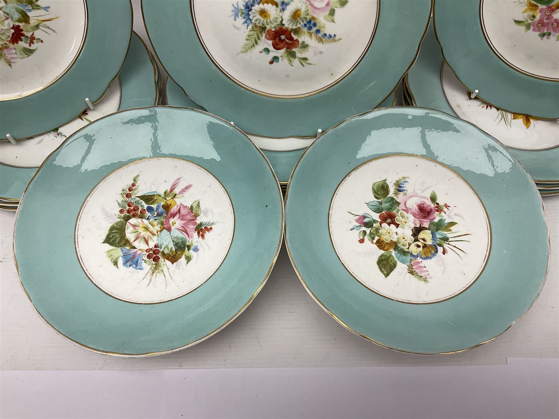 Victorian dessert service, comprising three comports and twelve plates, each decorated with floral sprigs to the centre with a blue and gilt border