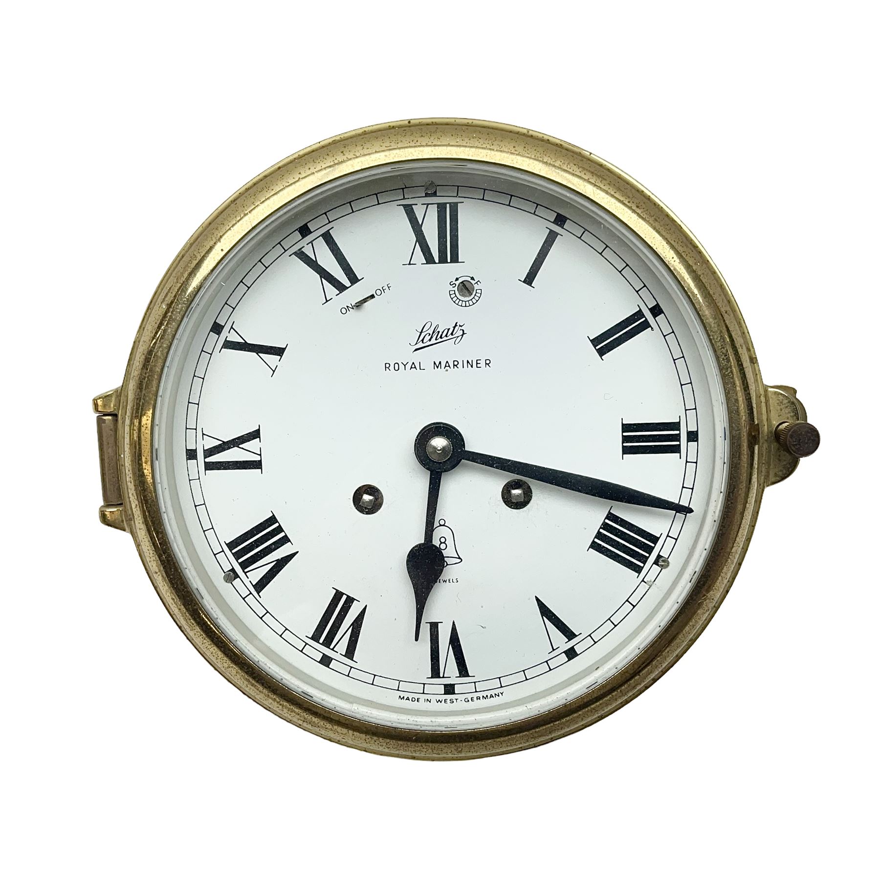 German Schatz Royal Mariner bulkhead ships clock, with an eight-day two-train platform seven-jewel movement, striking the ship's watch on a bell, with bells on/off facility and platform regulation on the 5 inch painted dial, with roman numerals and minute track, in brass case, case D16cm