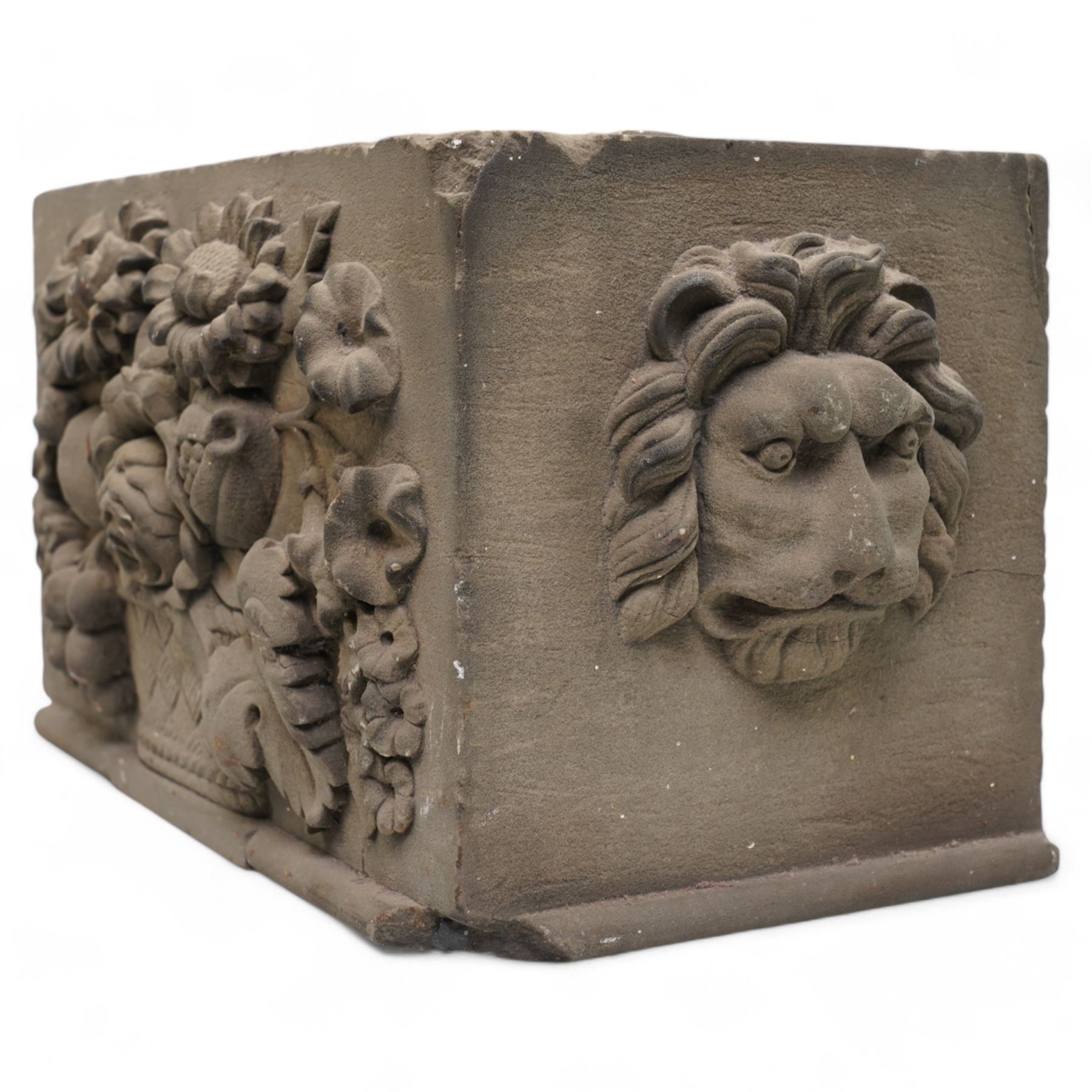 19th century rectangular coade stone casket , the front panel with a spray of flowers, the sides with lion masks 30cm x 15cm x 17cm