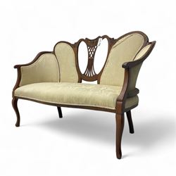 Edwardian mahogany settee, pierced shield back inlaid with cornucopias, upholstered in flo...