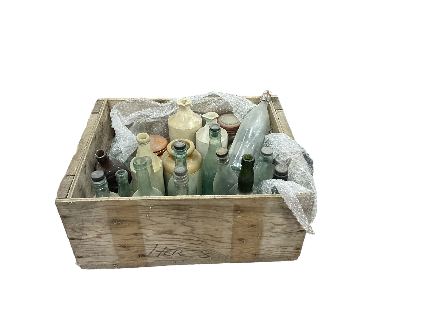 Quantity of mostly vintage glass bottles including examples of local interest, other glass jars and stoneware etc in wood crate