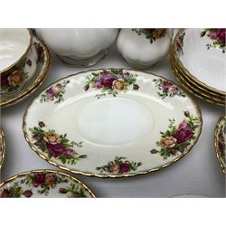 Royal Albert Old Country Roses pattern coffee set for four, comprising coffee pot, milk jug, cups and saucers, cake plate, together with six dinner plates, side plates etc (34) 