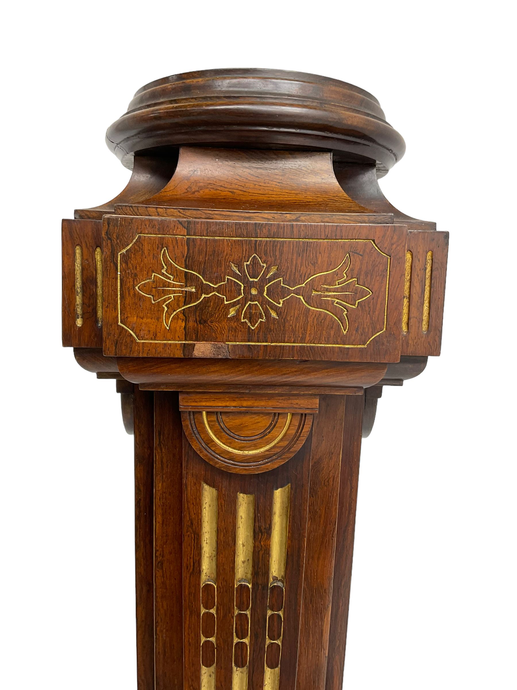 Late Victorian rosewood torchère, with carved and gilt decoration, fluted tapering column, stepped moulded plinth base, plaque underneath 'Urquhart & Adamson, Liverpool', hand written 'Mr. Jacobs',