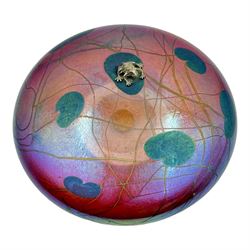 John Ditchfield for Glasform disc paperweight in iridescent cranberry with green lily pads...