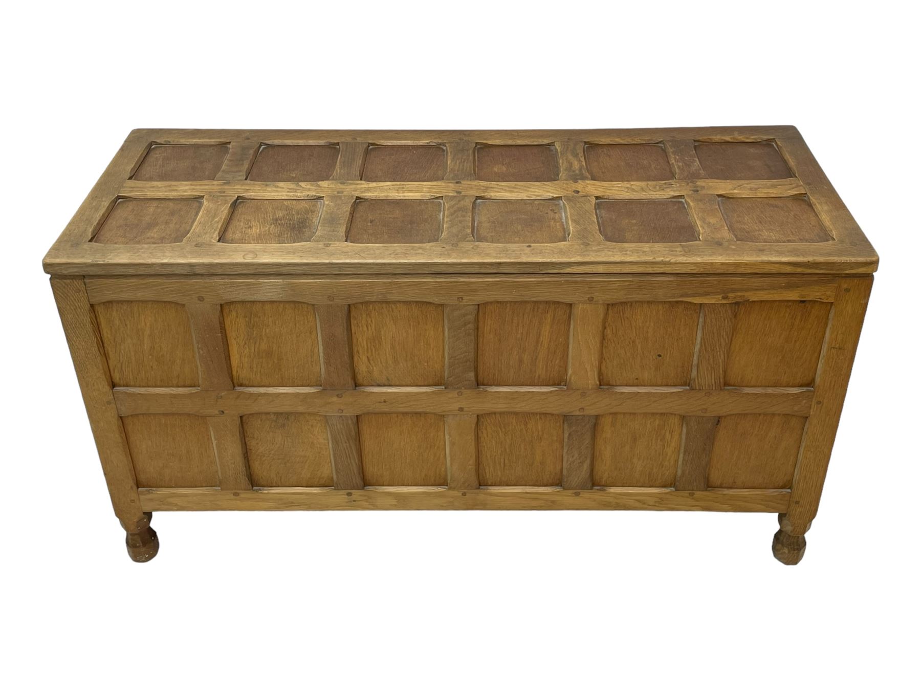 Sid Pollard (ex. Mouseman) - Yorkshire oak blanket chest, all over panelling, enclosed by hinged lid, on octagonal feet, interior plaque inscribed 'S. Pollard, Bagby, Thirsk, Yorks' 