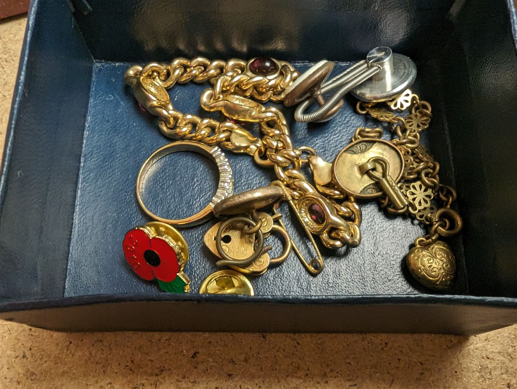 Collection of costume jewellery, including gold plated curb link bracelet, pin badges, charms, rings and jewellery boxes, together with an Edwin Blyde pewter hip flask etc 