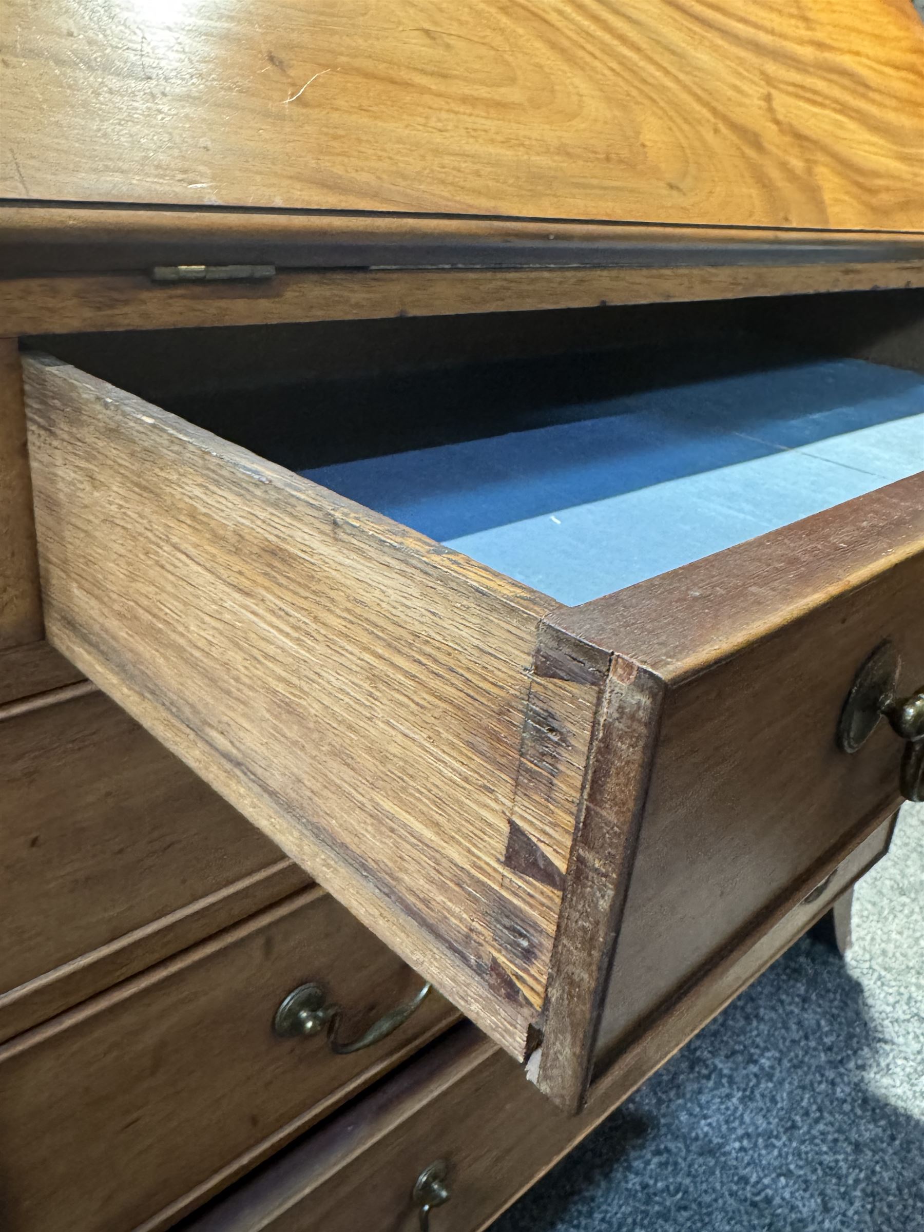 Georgian mahogany bureau, moulded fall front enclosing cupboard, small drawers, pigeonholes and inset writing surface, fitted with four long graduating cock-beaded drawers, on splayed bracket feet 