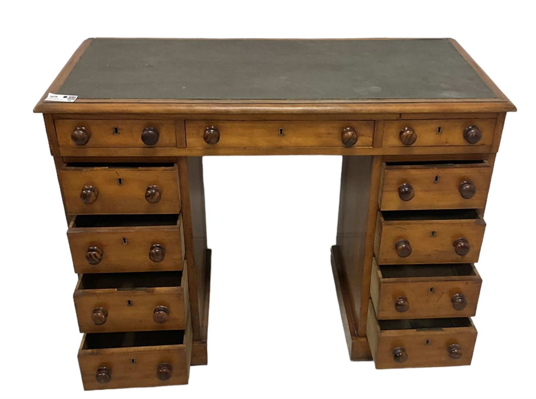 Victorian mahogany twin pedestal desk, rectangular top with inset green leather writing surface, fitted with central frieze drawer flanked by five graduating drawers on each side 