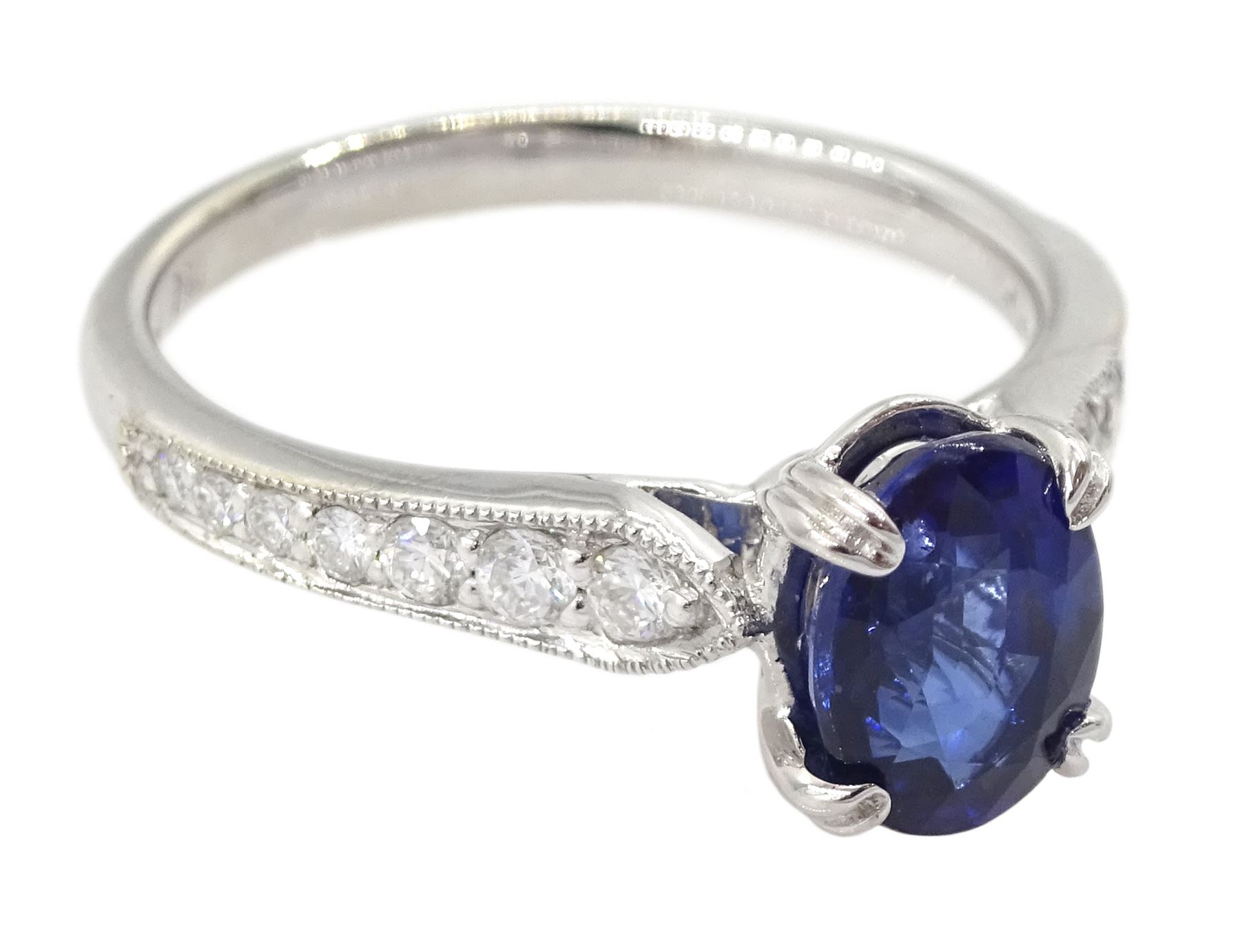 18ct white gold oval cut sapphire ring, with milgrain set round brilliant cut diamond shoulders, hallmarked, sapphire approx 0.80 carat, total diamond weight approx 0.40 carat