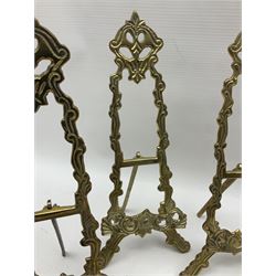 Set of six ornate cast brass easel stands, H30cm