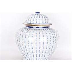 Large Oriental design ginger jar and cover, of squat baluster form with domed cover, decorated in blue with Chinese characters against a white crackle glaze ground, the cover, neck and foot rim with applied brass band, with character mark beneath, H43cm