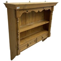 Pine farmhouse wall hanging shelf, shaped apron over single shelf and two drawers, flanked by split turned pilasters