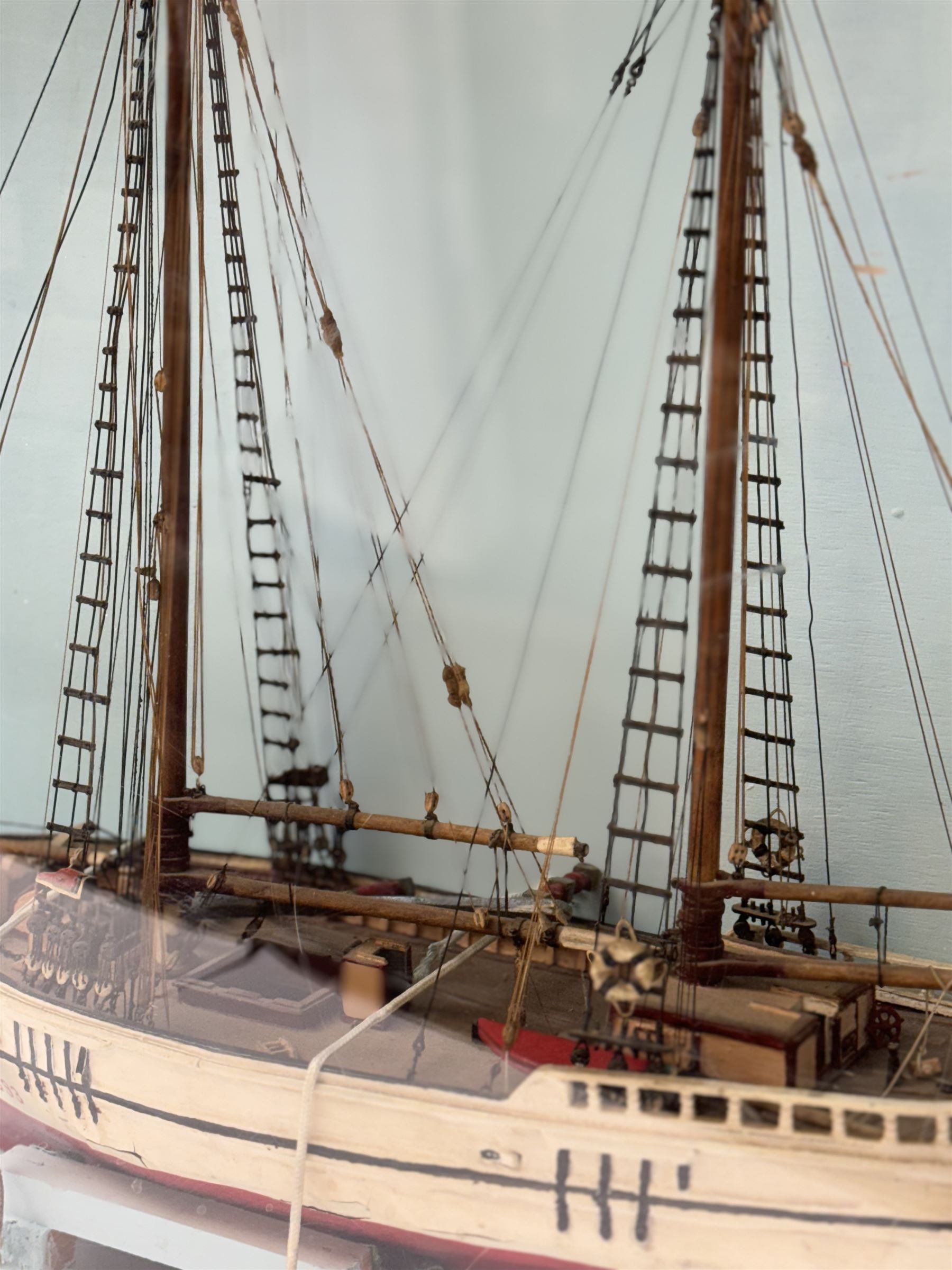 Scratch built model of a two-masted schooner, the red and white painted wooden body numbered GC-3-893, contained within wooden case, the interior painted in a light blue, with carry handle, excluding handle case H64.5cm, W67cm