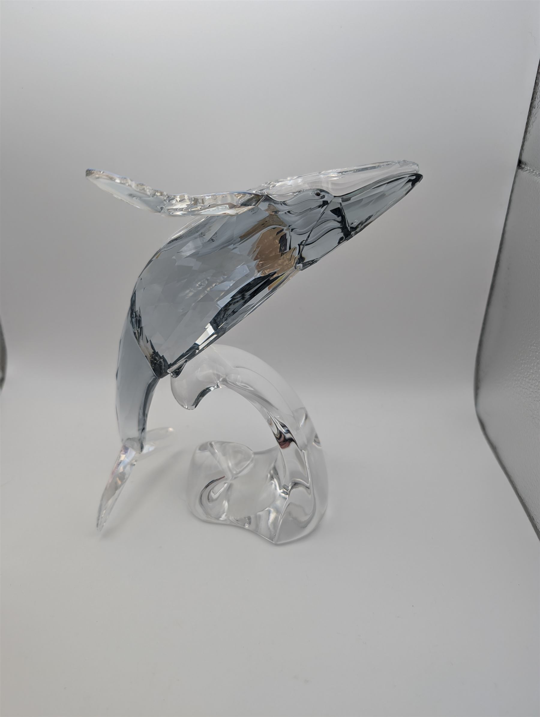 Swarovski Crystal humpback whale, Paikea, with crystal name plaque and a Swarovski Crystal penguin, whale H16cm