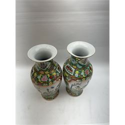 Pair of Famille Rose vases of baluster form, decorated with panels depicting musicians, H30cm