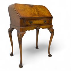 Early 20th century walnut bureau, the fall front enclosing fitted interior with pigeonhole...